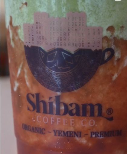 Reel still: close-up of a layered matcha drink in a Shibam Coffee Co. cup