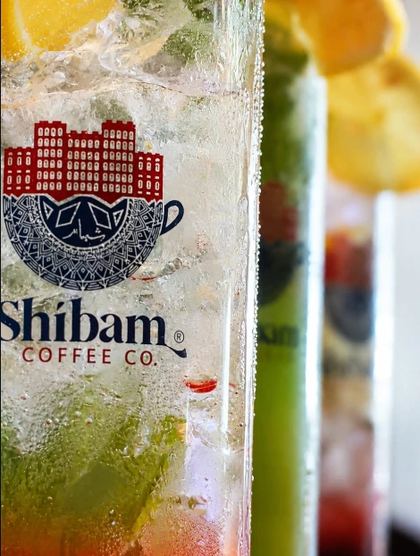 Close-up of an iced mojito in a Shibam Coffee Co. glass